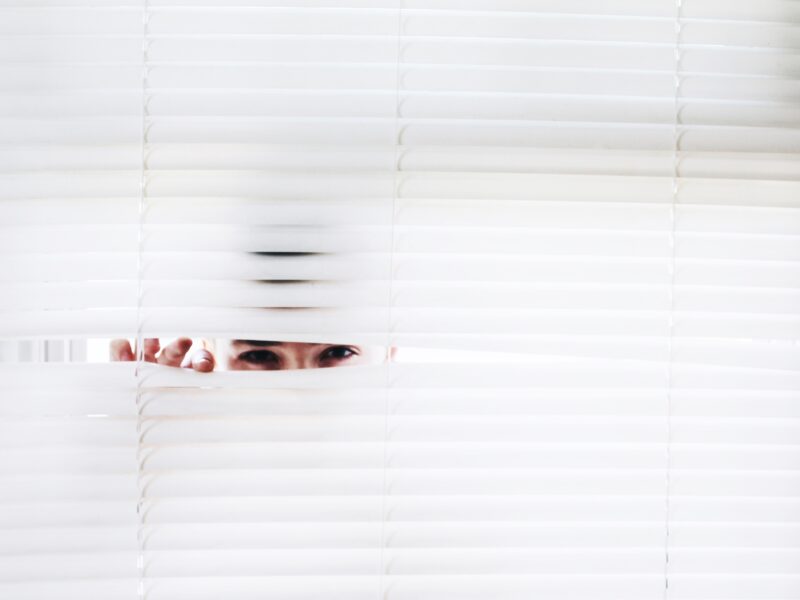 spying through blinds of dental practice