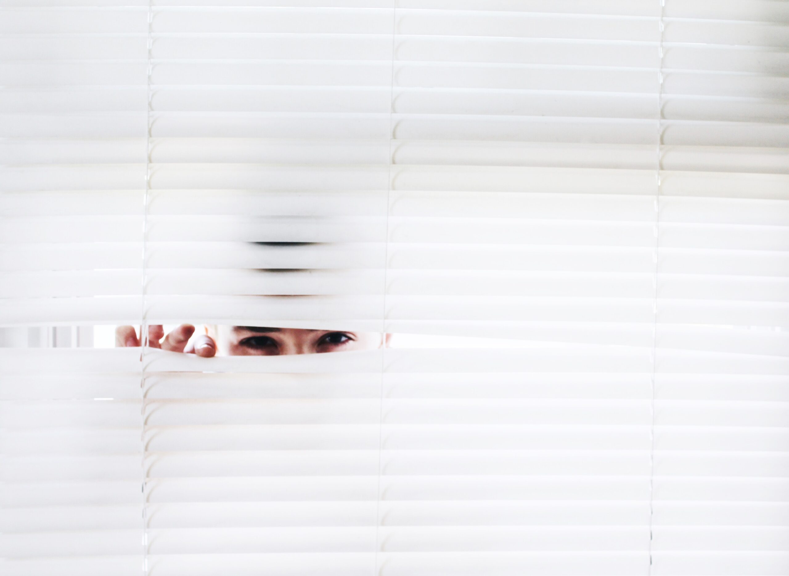 spying through blinds of dental practice
